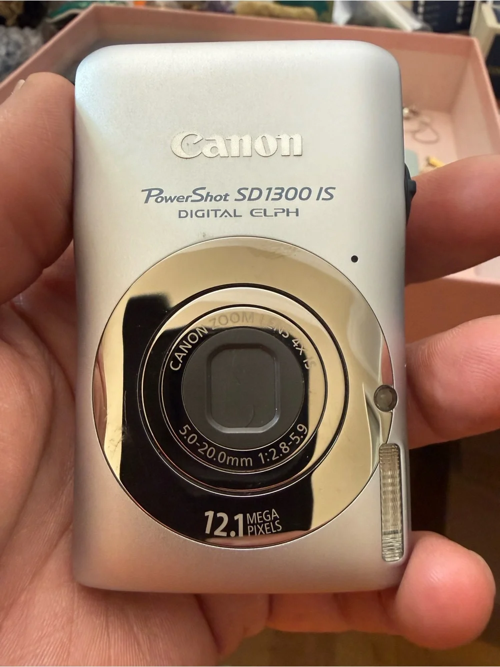 Silver Canon PowerShot SD1300 IS Digital ELPH camera.